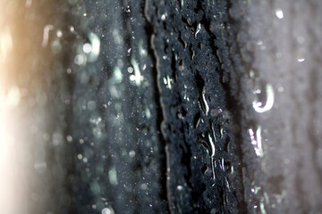 Close Up of Heavy Rain Floating Liquid Water Bubbles and Drips Black Background