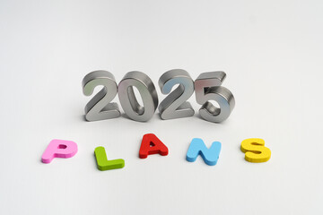 Naklejka premium 2025 plans concept alphabet 3D colorful text on white background