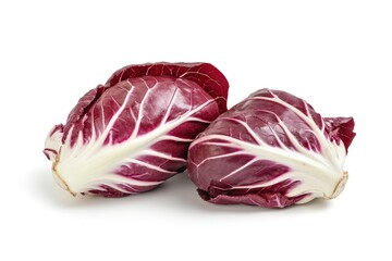 Obraz premium A pair of red and white radicchio heads, isolated on a white backdrop