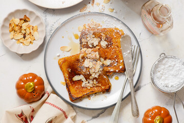 Pumpkin French Toast with Maple Syrup, Almonds and Powdered Sugar