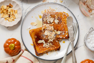 Pumpkin French Toast with Maple Syrup, Almonds and Powdered Sugar