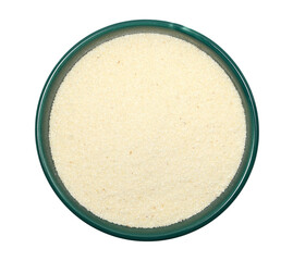 Pile of uncooked organic semolina in bowl isolated on white, top view, clipping
