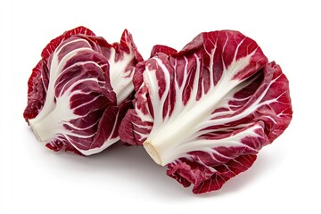 Obraz premium A pair of red and white radicchio heads, isolated on a white backdrop
