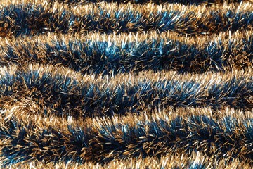 Beautiful shiny tinsel as background, closeup view
