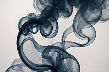 Dark smoke creating abstract shapes on white background