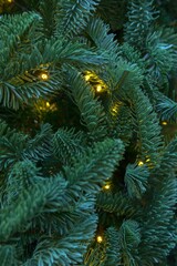 Yellow lights of a festive electric garland shine