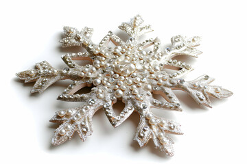 Fototapeta premium A decorative snowflake ornament embellished with pearls and jewels for festive occasions.