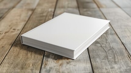 Fototapeta premium Blank White Book on Rustic Wooden Surface