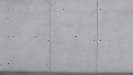 Concrete wall with vertical lines and small holes forming a texture background