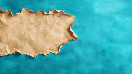 Obraz premium A piece of brown paper on a blue background