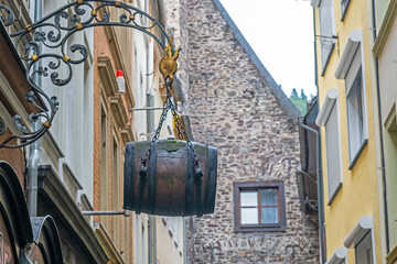 barrel-shaped decor on the wall of an old house