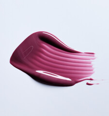 A burgundy maroon shade of lipgloss, lipstick smear, cosmetics beauty product texture, liquid blush, lipgloss swatch