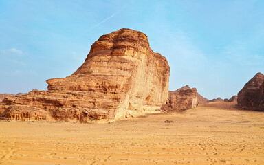 Sun shines over rocky desert formations, typical landscape in Al Ula, Saudi Arabia