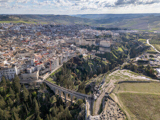 Aerial drone photo of the old Roman bridge in the town named Gravina in Puglia in southern Italy.