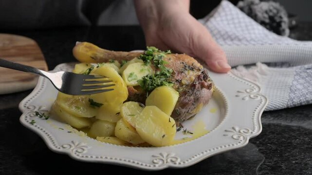 Elegant roasted duck leg served with golden potatoes and fresh herbs on a rustic plate. Perfect for showcasing gourmet dining, cozy home cooking, or culinary artistry. Ideal for food blogs, recipe vid