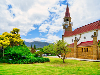 NG Kerk church surrounded by a lush green field in the charming town of Stanford, Western Cape,...