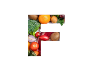 F lettering with vegetables and fruits isolated on a white background, cut out