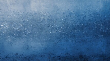 A blue texture with a grainy surface, with visible particles and imperfections