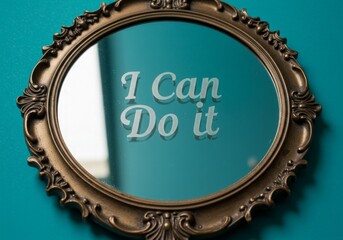 A mirror with the words I Can Do It written on the surface on a bold teal background