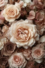 Elegant arrangement of cream and blush roses and delicate flowers creating a soft, romantic floral display