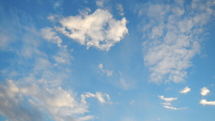 Blue sky and white Altocumulus clouds - weather background with natural patterns of clouds. Topics:...