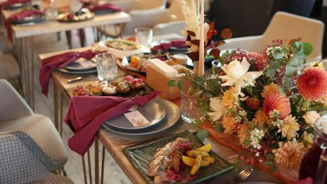 autumn decoration on the tables in the restaurant at the wedding