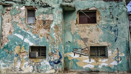 an old painted wall on a street in havana 
