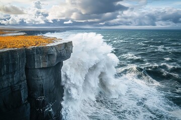 Majestic cliffs tower over crashing waves, showcasing nature's r