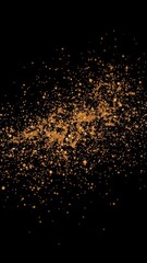 Scattered gold glitter sparkles on black background, holiday, dust