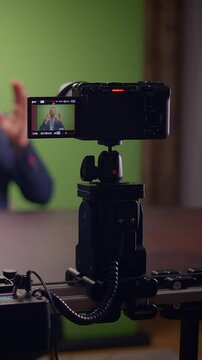 Setting Up a Filming Environment with a Camera Placed Firmly on a Tripod in a Studio Space