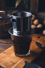 Preparing coffee in Vietnamese drip filter