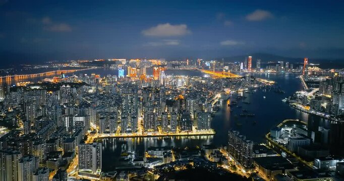 Aerial shot of modern city buildings skyline at night in macau