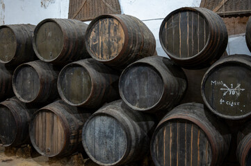 Solera system in old Andalusian wine cellar, process for aging sherry wine in barrels, fino, manzanilla, olorosso, amontillado jerez fortified wine, Sanlucar de Barrameda, Cadiz, Andalusia, Spain