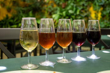 Flight of five sherry wine from barrels, fino, manzanilla, olorosso, amontillado, pedro ximenez jerez wines in old tavern, wine tasting, Sanlucar de Barrameda, Cadiz, Andalusia, Spain