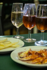 Tasting of sherry wines from barrels, fino, manzanilla, olorosso, amontillado jerez wines with traditional Andalusian tapas in old tavern, Sanlucar de Barrameda, Cadiz, Andalusia, Spain