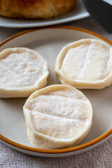 Rocamadour or cabecous soft goat AOC cheese with soft rind produced on farm in Perigord and Quercy on farmers market, departement Lot, France