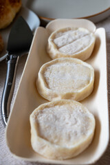 Rocamadour or cabecous soft goat AOC cheese with soft rind produced on farm in Perigord and Quercy on farmers market, departement Lot, France