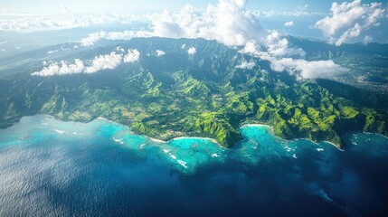 Aerial view of lush green mountains meeting turquoise waters in a tropical landscape.