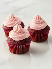 Freshly Frosted Cupcakes with Pink Frosting on a Marble Surface