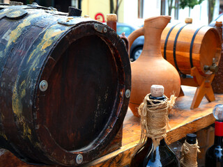 Homemade wine in a barrel, jug and bottle (Georgia).