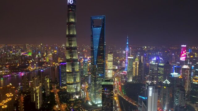 SHANGHAI, CHINA - NOVEMBER 7, 2024: Aerial view of Shanghai skyline at night featuring illuminated skyscrapers and vibrant city lights