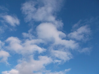 Beautiful white puffy clouds in a deep blue sky.