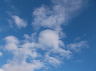 Beautiful white puffy clouds in a deep blue sky.