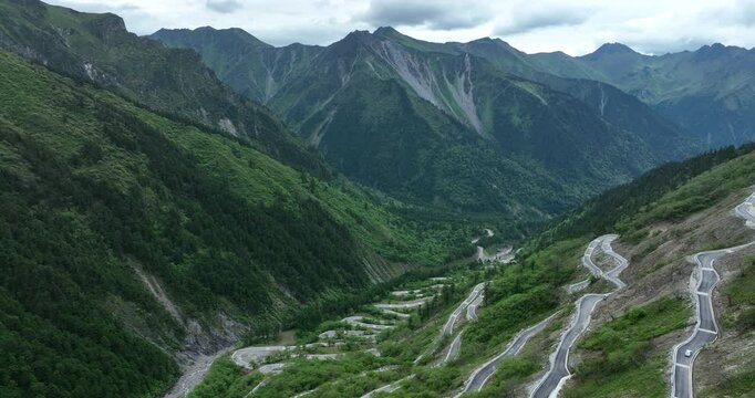 Aerial footage of beautiful high altitude grassland and mountain landscape