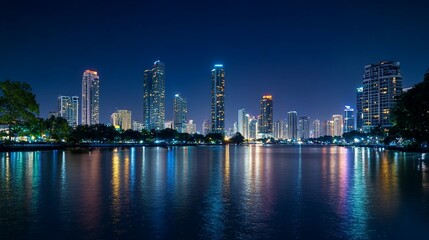 Fototapeta premium Night cityscape reflected in calm water.