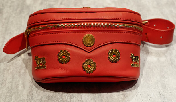 Red leather Mountain pouch with adjustable belt and gold elements by Bally.Milan - Italy,20 December 2024