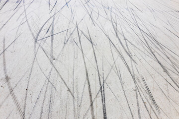 Asphalt road with marks from bicycles and cars. Abstract. Background.