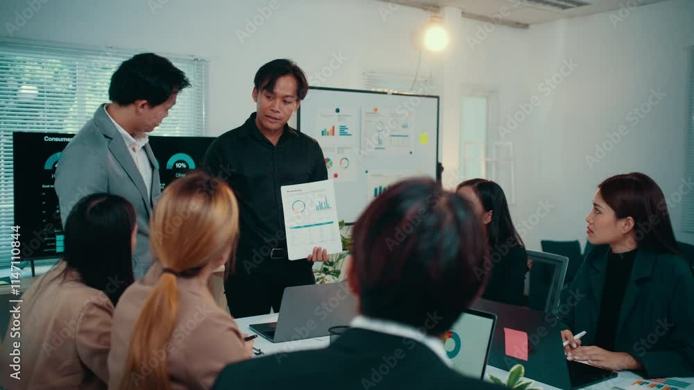 Aufkleber Office workers analyzing marketing data on charts and graphs, engaging in collaborative problem-solving and strategic planning during a productive meeting
