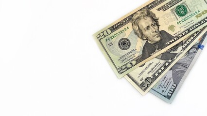Stack of US dollar bills including 20, 50, and 100 notes on a white background, suitable for financial, banking, or investment-related themes. Ideal for advertising or educational content.