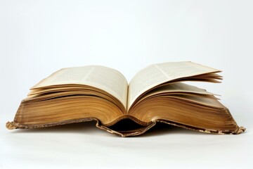 Obraz premium Open antique book with weathered pages and visible text lying on a white background
